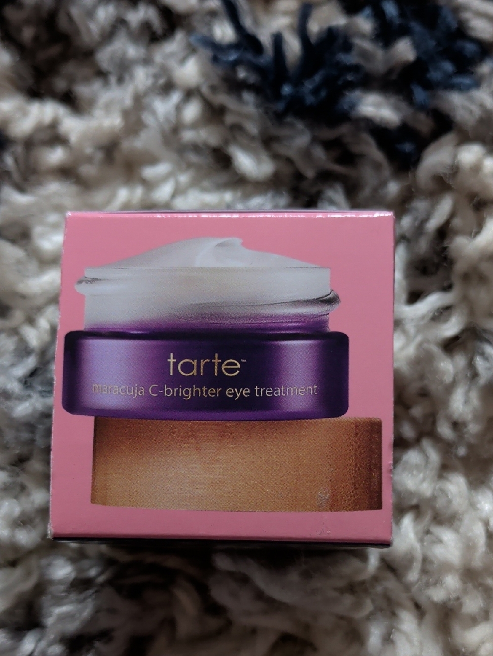 tarte eye treatment box in pink and purple with gold accent
